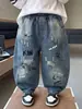 Calça Jeans Denim Masculina Primavera e Outono Menino Bonito Estilo Coreano Calças Casuais 2026 Nova Calça Versátil Infantil Comércio Exterior