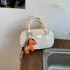 Bolsas Tendência e Populares deste Ano para Mulheres 2025 Nova Versátil Moda Bolsa Bowling Nicho Comutador Bolsa Transversal