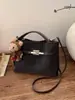 Bolsa Pequena Retro Transfronteiriça para Mulheres 2026 Nova Coleção de Primavera Versátil Bolsa de Mão para o Dia a Dia Bolsa Saco Bolsa de Ombro Transversal Texturizada