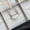 Colgante de Tubo Curvo de Cristal Imitación Ojo de Gato Nuevo Estilo Chino Fresco Tubo Curvo Nicho Hielo Translúcido Exquisito Temperamento Versátil Collar