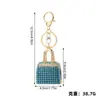 Estilo de Moda de Lujo Ligero Europeo y Americano Mini Bolso de Mano Completamente Cubierto de Diamantes Colgante para Llavero Diseño de Nicho Accesorio para Bolso de Mujer