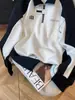 Sudadera de Terciopelo con Media Cremallera para Hombre 2025 Primavera y Otoño Nuevo Diseño de Empalme en Contraste de Color Blanco y Negro