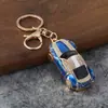Llavero de coche deportivo con incrustaciones de diamantes en stock, colgante creativo de modelo de coche de esmalte, accesorio para bolso de mujer, artículo promocional