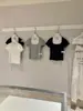 Wgwe9362 Ropa de Mujer Shisanxing de Guangzhou 2026 Verano Nuevo Cuello Cuadrado Ribete de Encaje Manga Corta Camiseta Top Delgado