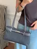 Elegante bolso bandolera Xiaomi de nicho para mujer 2026 nuevo bolso retro de cuero con hebilla para debajo del brazo bolso de chica hot para motocicleta bolso baguette