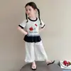 Conjunto de Roupa de Gato Maçã para Meninas Verão 2026 Nova Moda Estilo Coreano Manga Curta Macacão Wide-Leg para Bebê Conjunto de Duas Peças Tendência