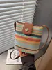 Bolsa Transversal de Tecido Listrada Arco-Íris Moda Tendência Verão 2026 com Design Único de Contraste de Cores Bolsa de Praia