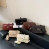 Bolso Pequeño de Textura Simple para el Trabajo Mujer 2026 Otoño Nuevo Versátil Nicho Casual Bolso de Hombro Elegante Bolso de Axila