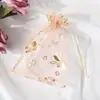 Bolsa de gasa bauhinia multicolor para bronceado en stock al por mayor bolsa de organza para dulces de boda con cordón paquete de regalo de boda bolsillo