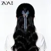 Elegante pasador de pelo coreano estilo mariposa azul hielo medio recogido con un toque de alta gama, hecho a mano con cuentas y borlas de cristal, pinza de tiburón para mujer