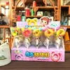 Paletas y Caramelos Duros en Varias Formas de Frutas para que los Niños Compartan Dulces y Den a sus Amigos Regalos Navideños. Puestos en la Puerta de la Escuela