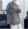Camisa retro de otoño de estilo coreano, moderna, estilo Hong Kong, estampado de leopardo, manga larga para hombre, camisa básica de pareja moderna de estilo coreano, corte holgado
