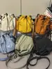 Mini Bolsa de Lona de Verão para Mulheres 2025 Nova Marca Tendência Bolsa para Celular Casual Esportes Viagem Crossbody Pequena Bolsa de Balde