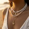 Colar de metal estilo oceânico europeu e americano com estrela-do-mar e concha de vieira para mulheres, Joia de clavícula boho ins com pérolas artificiais