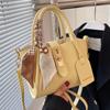 Bolso de mujer con nuevo diseño de nicho 2022, moderno bolso bandolera de verano con textura a juego.
