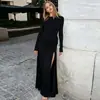 Moda Femenina 2026 Otoño Nuevo Estilo Europeo y Americano Transfronterizo Vestido de Color Sólido con Cuello Redondo, Manga Larga, Plisado y Abertura
