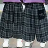 Pantalones de Cuadros con Bolsillo de Oso para Niños Primavera y Otoño 2026 Nuevo Otoño Estilo Coreano Frescos Pantalones Casuales para Bebé Pantalones Deportivos Modernos