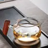 Taza de vidrio con mango de madera para uso público, té espeso de mar, venta al por mayor, juego de té de kung fu japonés de alto valor de color, juego de filtro de té, taza para el hogar