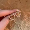Pendientes de Perla con Forma de Lazo Hueco para Mujer Moda Joker Pequeños Frescos Dulces Lindos Pendientes Joyería Venta al por Mayor
