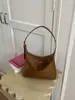 Bolsa de ombro retrô popular transfronteiriça para mulheres, nova bolsa de mão de nicho de alta qualidade para trabalho e deslocamento, bolsa de ombro