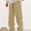 2026 Nuevo Modelo Pantalones Deportivos Casuales para Hombre de Corte Recto con Cintura de Cordón Estampado Cruzado para Exportación