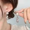 Pendientes de borlas con forma de hoja de perla y aguja de plata, diseño de personalidad de viento frío, pendientes de temperamento de Joker de nicho, venta al por mayor