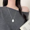 Collar minimalista de cordón negro con colgante de gota de agua ovalada cepillada para mujer, estilo coreano, cadena larga ajustable para suéter, accesorio elegante y versátil