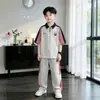 Conjunto de Verano de Manga Corta para Niños 2026 Nuevo Estilo Niños Grandes Verano Casual Niños Delgado Transpirable Camisa Polo Infantil Moderna