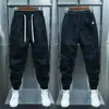 2023 primavera nuevo pantalón casual para hombre peto tobillero moda marca costuras color sólido suelto harem lápiz