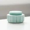 Tarro de té cerámico pequeño tamaño mini tarro de almacenamiento de bálsamo en polvo fragante caja de embalaje tarro de té pequeño 10ml logo imprimible