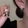 Nuevos Pendientes de Corazón con Lazo Negro Sencillo de Aguja de Plata S925 para Mujer Coreanos de Lujo Ligero Temperamento Joyería de Oreja de Alta Gama Tendencia