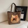 Mochila Biscuit Cat para mujer, otoño 2024, nueva bolsa de mano de estilo universitario de moda, bolso de hombro de gran capacidad de Corea del Sur.