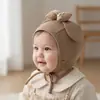 Nuevo Sombrero Protector de Orejas con Lazo 2026 Sombrero para Bebé Estilo Nuevo Primavera y Otoño Sombrero Protector de Orejas de Suéter para Niños y Niñas