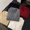 2026 Nuevo cárdigan de punto con cuello de muñeca estilo coreano y manga larga para mujer, corte holgado, adelgazante, suéter versátil para mujer