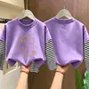 Camiseta de manga larga a rayas de algodón puro estilo coreano para niñas, nueva tendencia versátil de otoño 2026, top básico para niños mayores