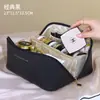 Etiqueta de cuero almohada bolsa de maquillaje bolsa de maquillaje portátil bolsa de aseo de viaje al por mayor bolsa de almacenamiento de maquillaje
