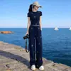 Conjunto de Duas Peças Salt Style Primavera/Verão 2026 Esportivo Maduro Casual Redutor de Idade Top com Strass e Calça de Pernas Largas