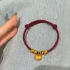 Pulsera tejida hecha a mano para el año de nacimiento, Pulsera de hilo dorado arena rojo al por mayor, Hazte rico inmediatamente, Tejido de bolsa de la suerte del Dios de la Riqueza amarillo