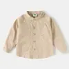 Camisa Branca de Gola Alta para Meninos da Academia 2026 Novo Estilo Outono Jaqueta Japonesa Solta Fina para Crianças Camisa Versátil para Meninos