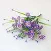 Flor artificial al por mayor hierba acuática plástico hierba de primavera flor Violeta acabado impresión serigráfica flor pequeña Margarita flor falsa accesorios decorativos Flor