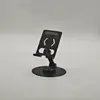 Soporte Plegable de Metal para Teléfono Giratorio 360° | Soporte de Escritorio Ajustable con Silicona Antideslizante, Puerto de Carga y Eje Duradero