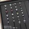 Nuevos y modernos aretes de cruz con diamantes completos Jiuhan para mujer, ear cuffs de acero de titanio de nicho, populares tachuelas de hueso de la oreja de alta gama