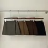 Saia outono nova assimétrica elegante com cinto lateral, cintura alta, afina a silhueta, saia evasê anti-exposição