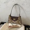 Bolsas de Moda Retrô Femininas 2026 Outono Novo Pequeno Nicho Ombro Único Axila Alta Aparência Pequena Bolsa Quadrada Casual Bolsa Transversal