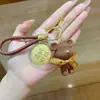 Llavero de Oro Puro 999, Mejorando Cada Vez Más, Feliz Cumpleaños 520, Oso de Hilo Bolsa de Oro Colgante Venta al Por Mayor