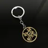 Llavero colgante de aleación de metal con diseño de mariposa Zhilang You Bean de Anime Ghost Extermination Blade que rodea el carbón. Comercio exterior.