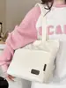Otoño 2026 Nuevo Lona Gran Capacidad Moderno Alta Apariencia Color Sólido Moda Sensación Relajada Bolso Tote para Trabajar y Viajar