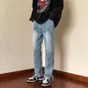 Jeans de hombre de moda estilo americano de calle transfronterizo con aberturas laterales, cierre de cremallera y botón en los puños, corte recto, jeans con efecto adelgazante