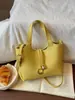 Elegante y moderno bolso tipo cubo para mujer, nuevo bolso de un solo hombro, 2026 verano, color sólido, piel suave, bolso cruzado súper popular