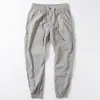 Venta al por mayor transfronterizaPantalones casuales finos de seda helada de verano para hombre Pantalones japoneses simples con tobillo atado elástico Pantalones cargo holgados